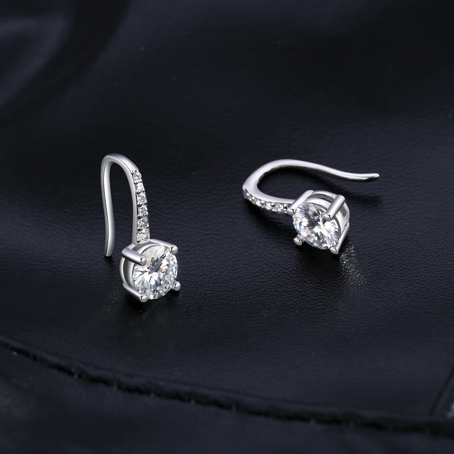 Classic moissanite earrings styled as refined drop earrings