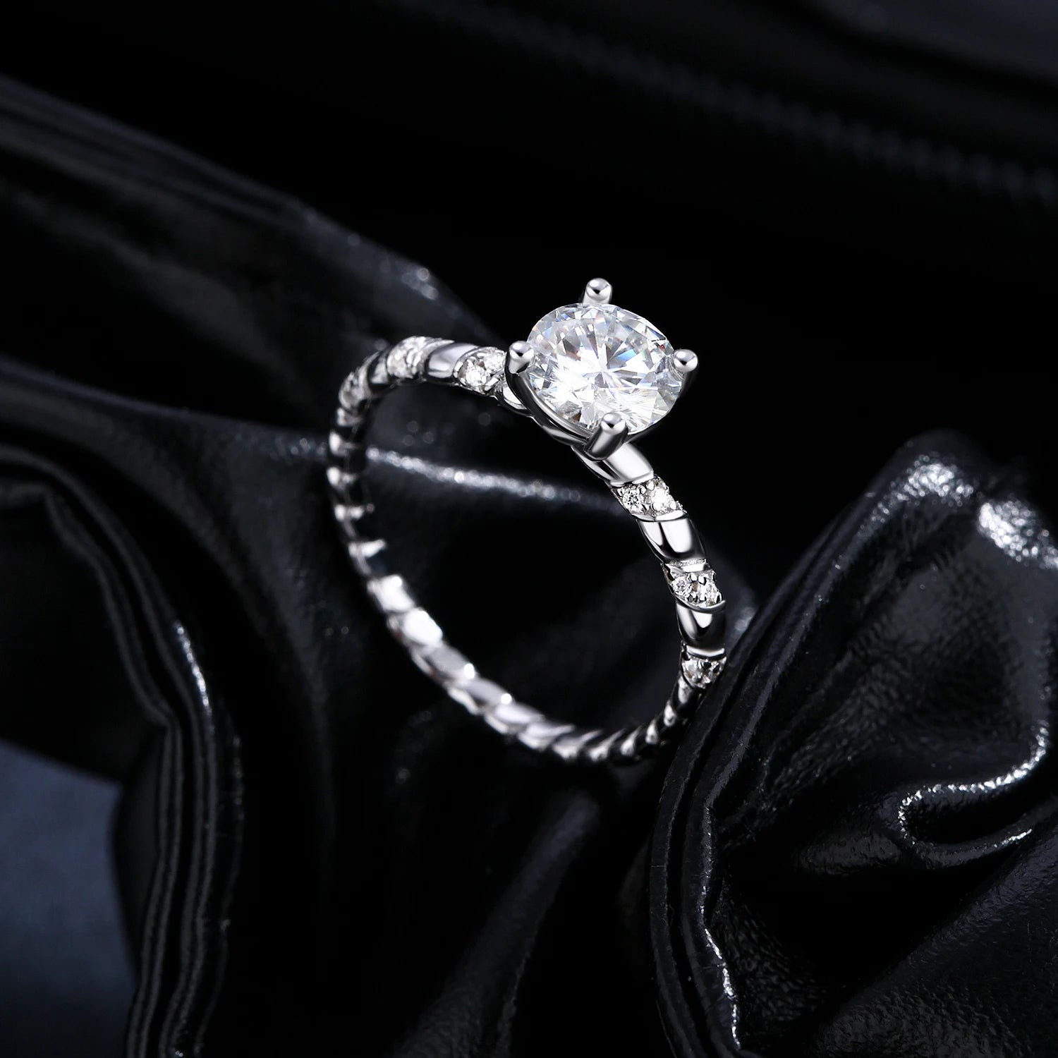 Sterling silver ring size design with twist detail and moissanite