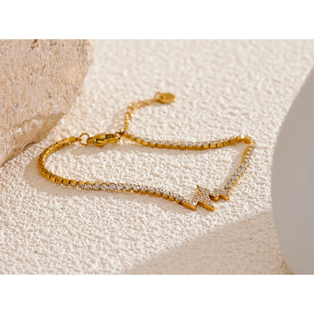 Close view of chain bracelet links with cubic zirconia and gold in chain detail