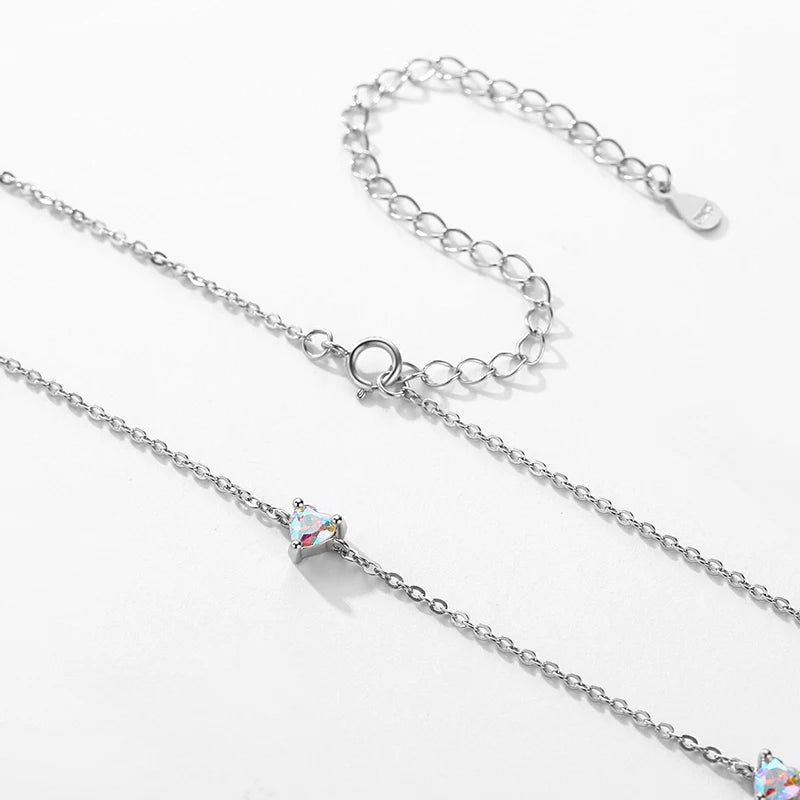 Silver necklace styled with heart earrings as an elegant earrings set