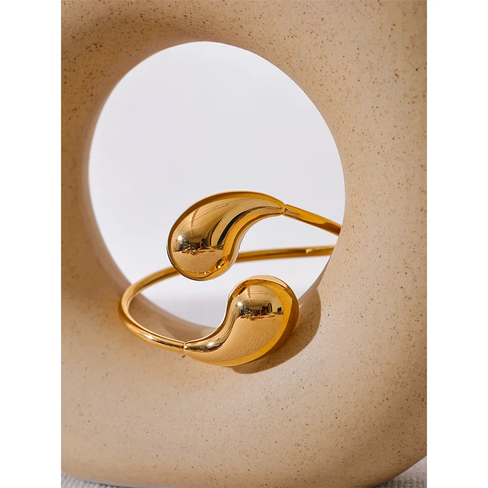 Curved band highlighting gold bracelet gold glow in soft light