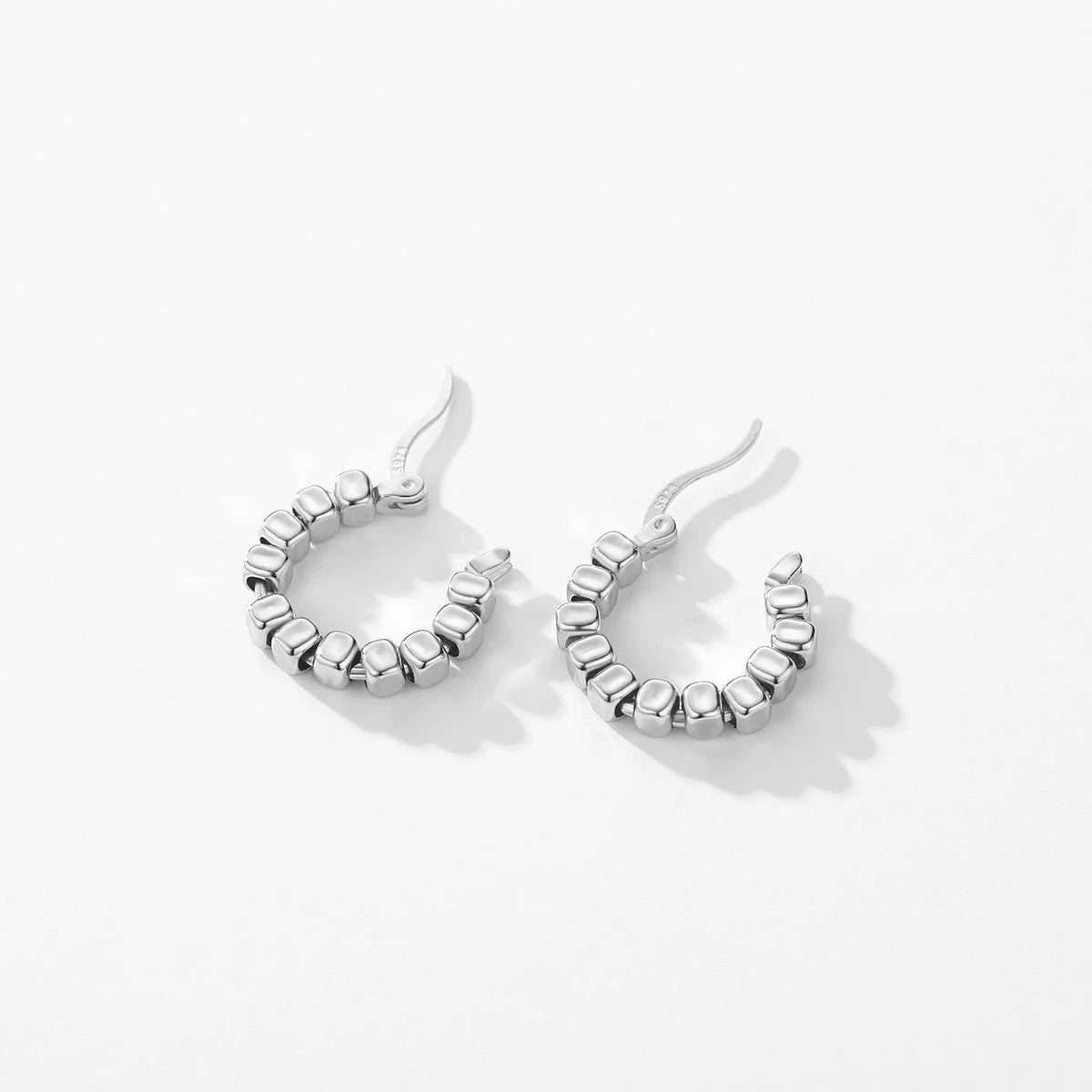 Women’s geometric silver hoop earrings buckle style