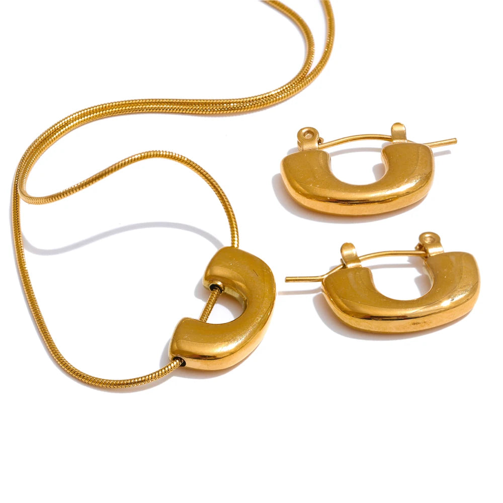 Gold plated U shape necklace and earrings set styled as layered gold jewelry
