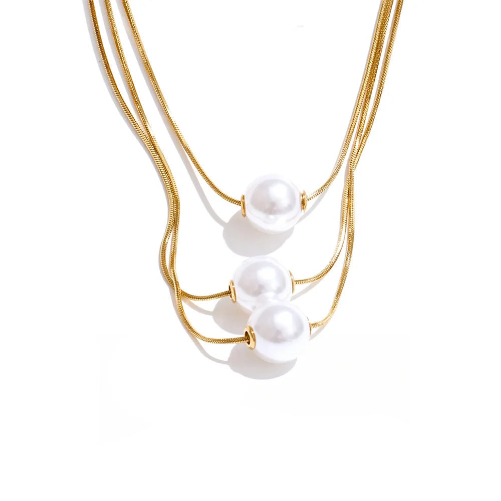 Three layer pearl pendant necklace with gold plated shine