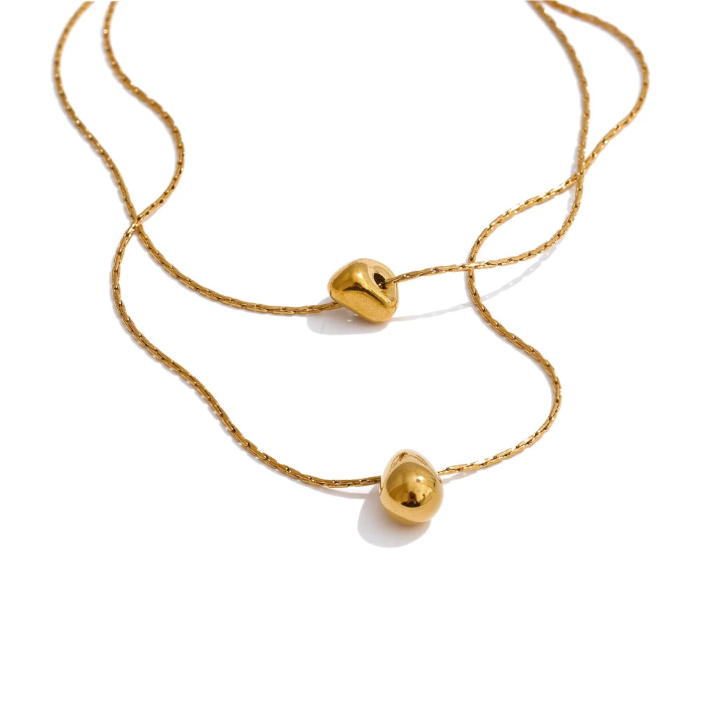 Day to night styling of pendant with necklace in layered stainless steel jewelry