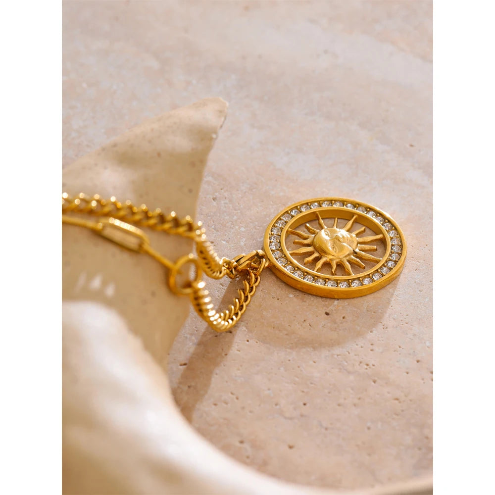 Sun hollow pendant reflecting gold necklace gold tones and fine zirconia sparkle