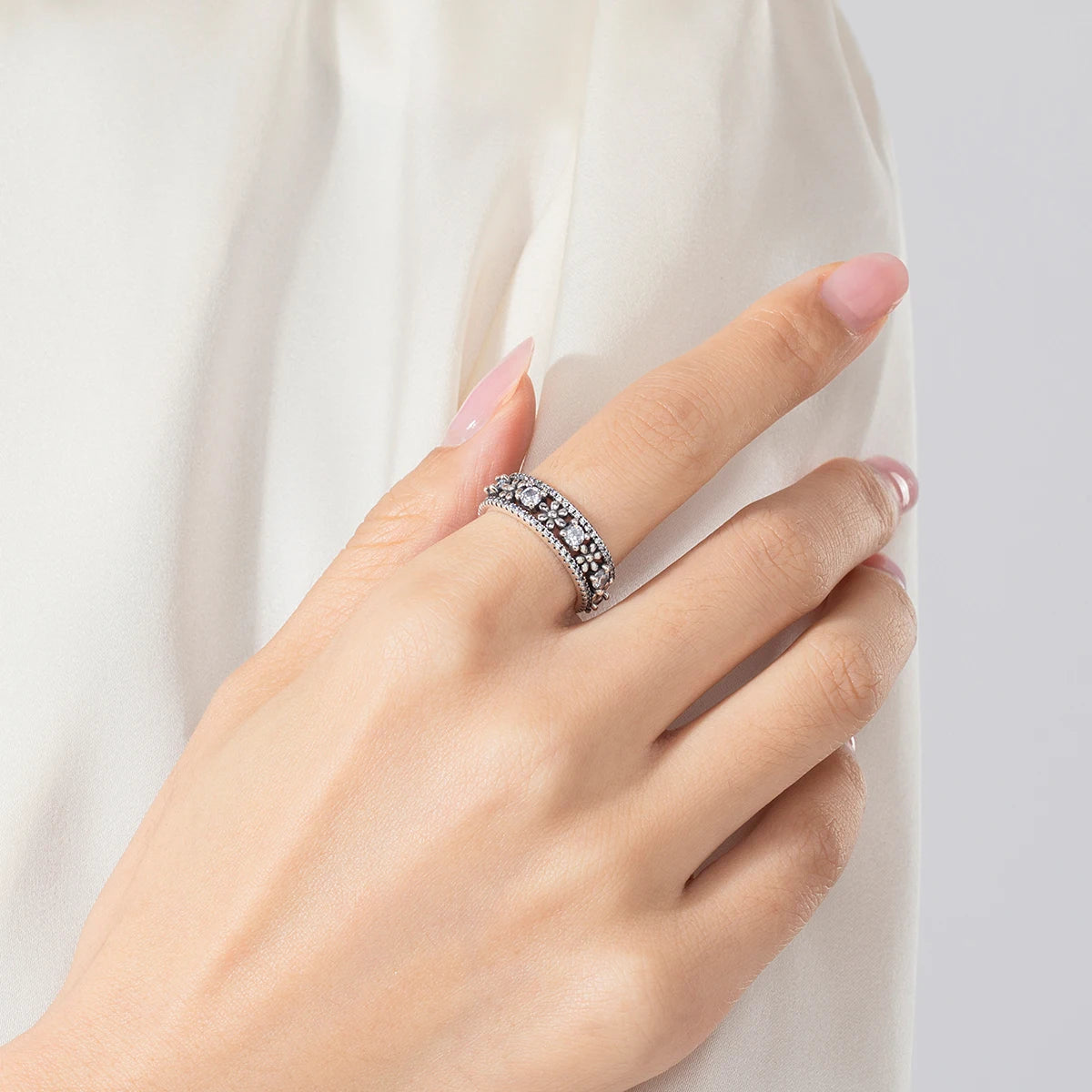 Close view of sterling silver ring showing polished silver ring band