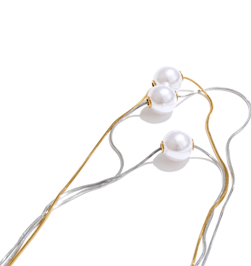 Necklace and necklace layering with soft pearl accents