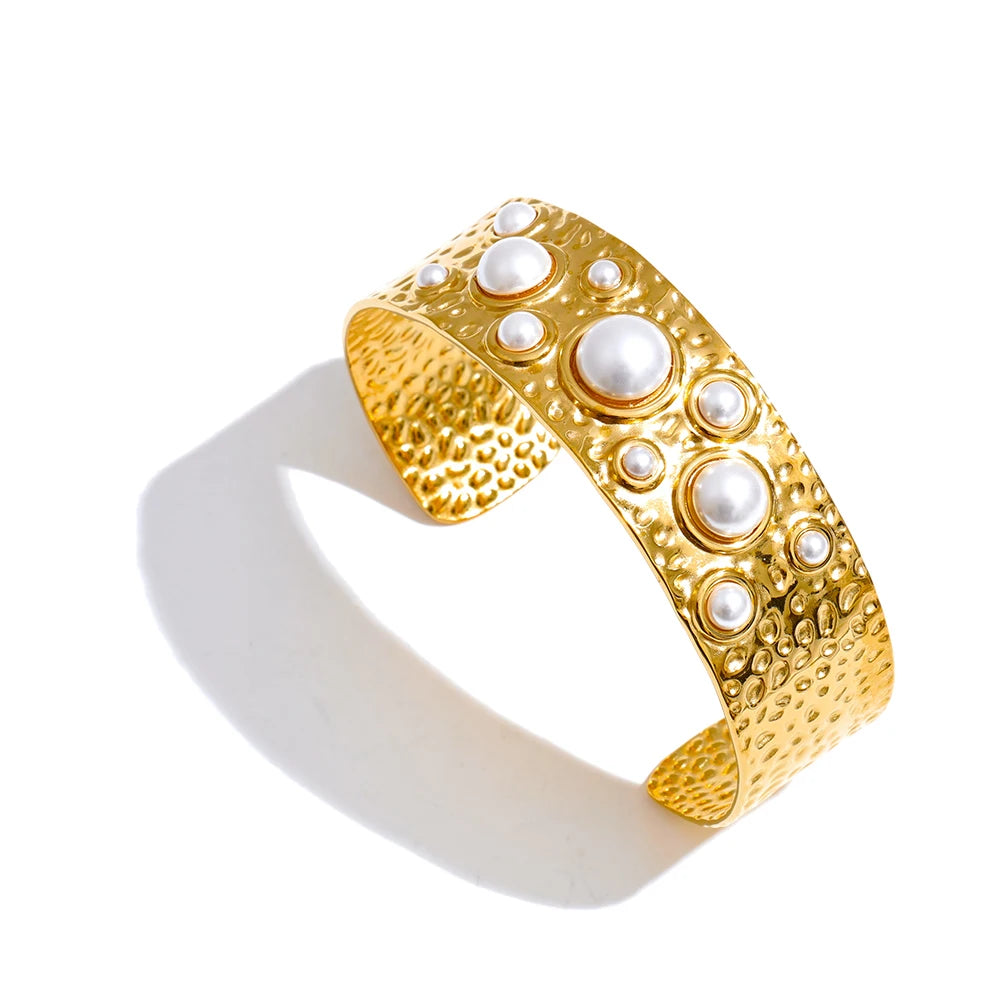 Contemporary bangle gold bangle styling with refined texture