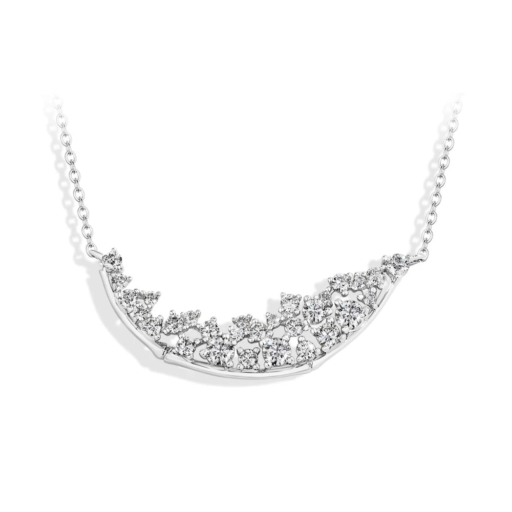 Silver moon motif on a sterling silver necklace with moissanite diamond