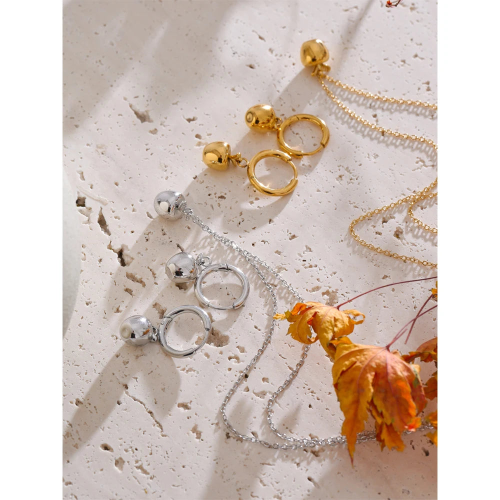 Gift box showing gold necklace and earrings gold earrings together