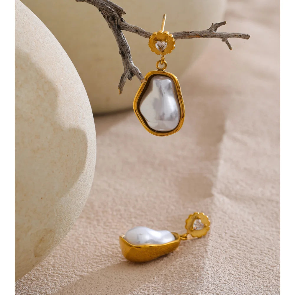 Elegant ear rings featuring simulated pearls and gold finish