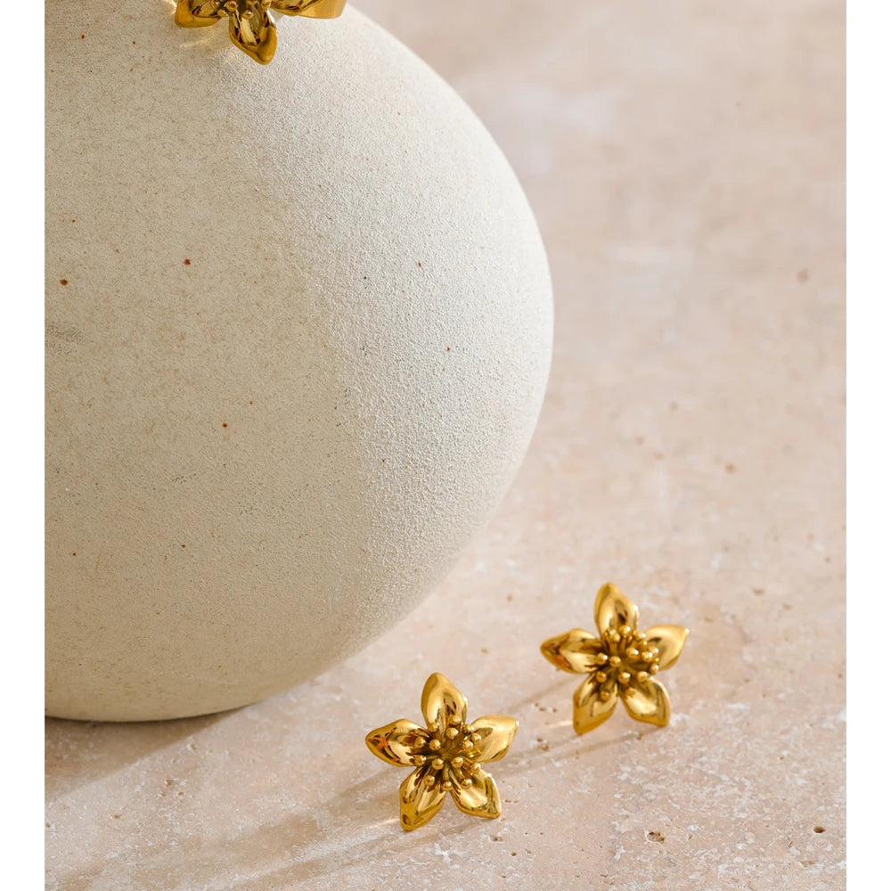 Waterproof jewelry set featuring earrings earrings gold and a gold ring