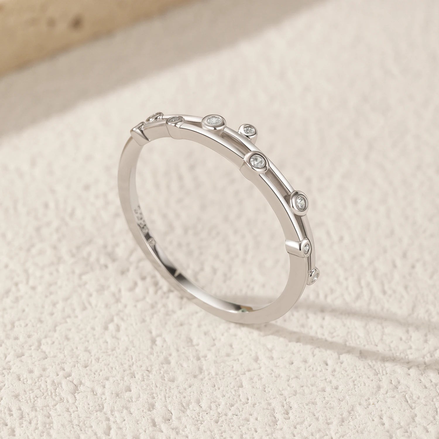 Round CZ ring in sterling silver with layered line design