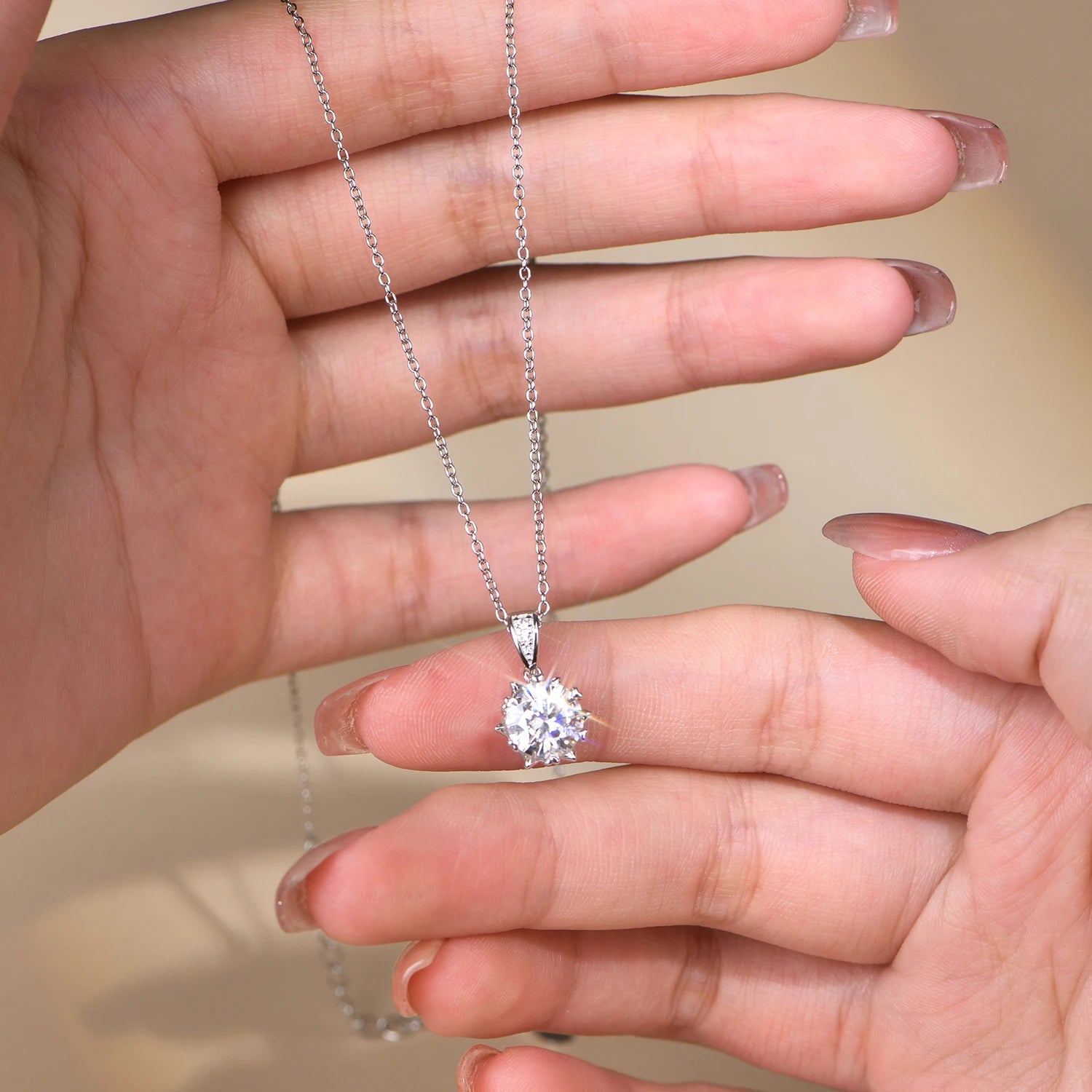 Pendant necklace styled as a long necklace with elegant moissanite chain