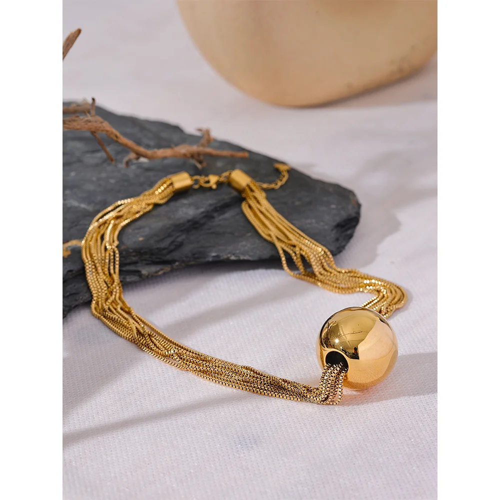 Gold i necklace look with layered chain and round ball pendant