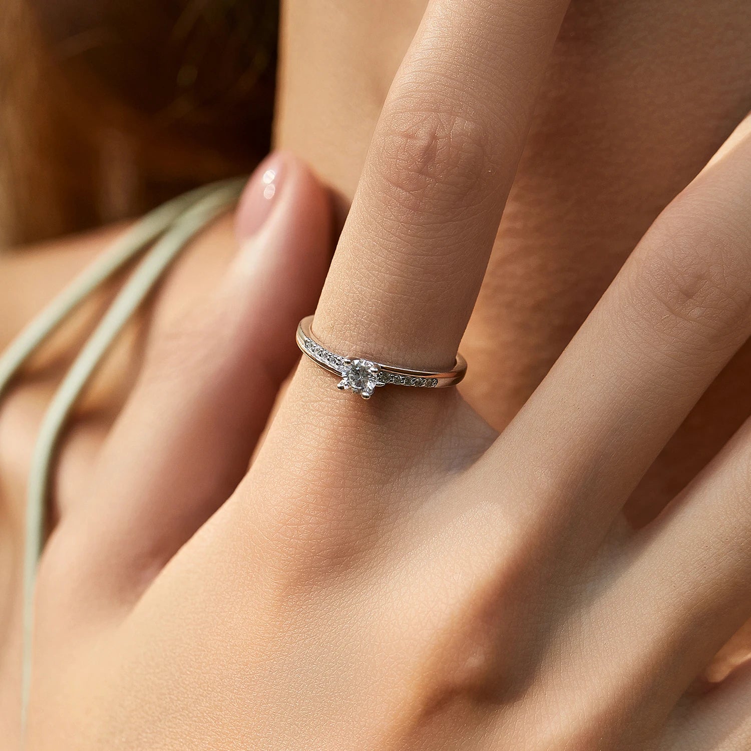 Classic wedding ring shown as a silver ring with subtle rose gold accent