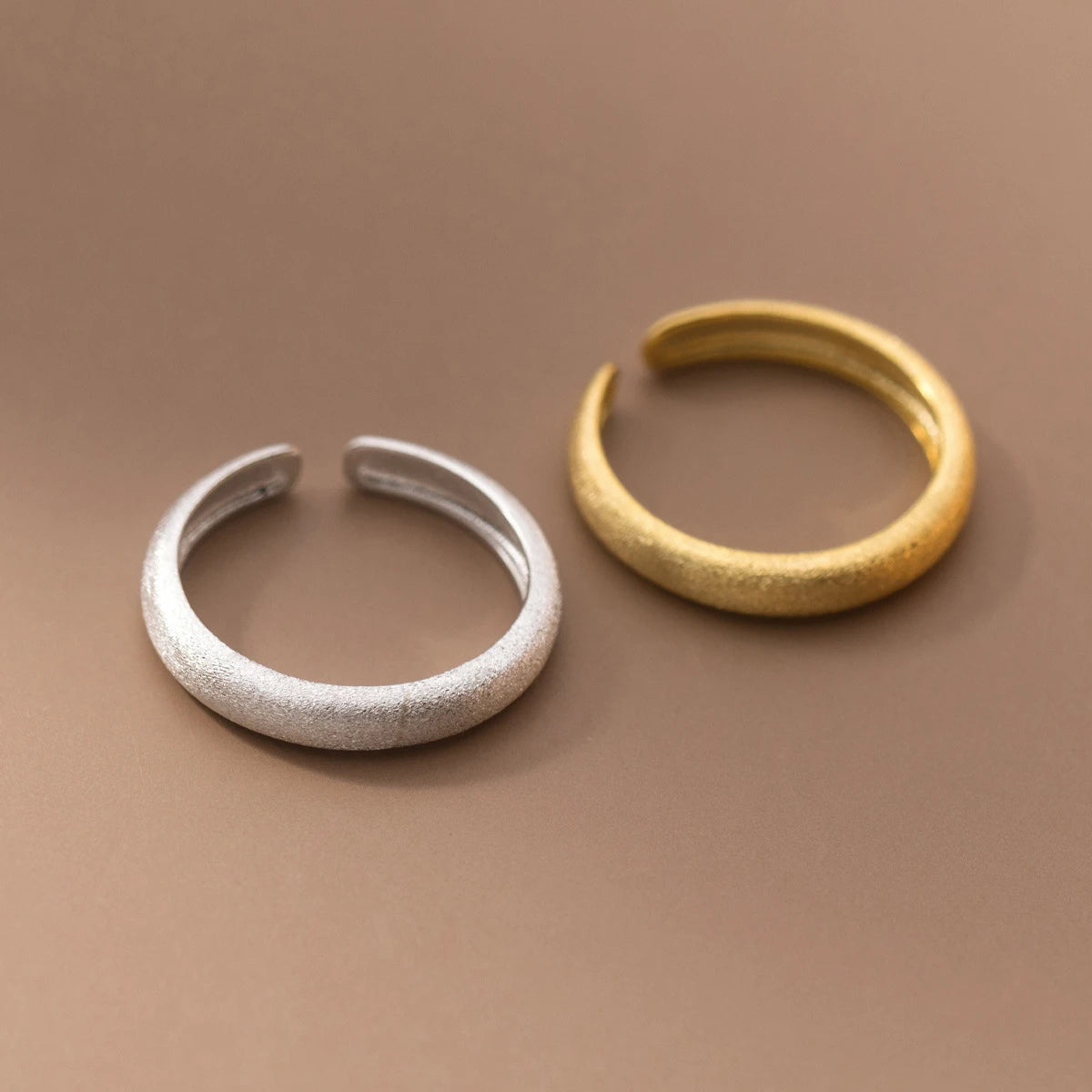 Silver ring with gold edge creating a sleek modern profile