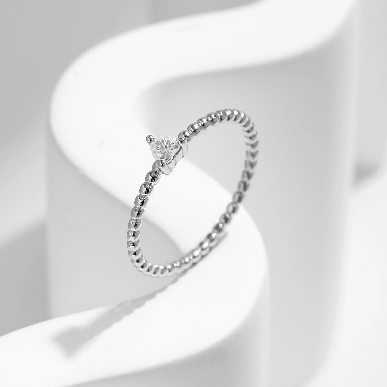 Romantic diamond engagement rings style with moissanite center