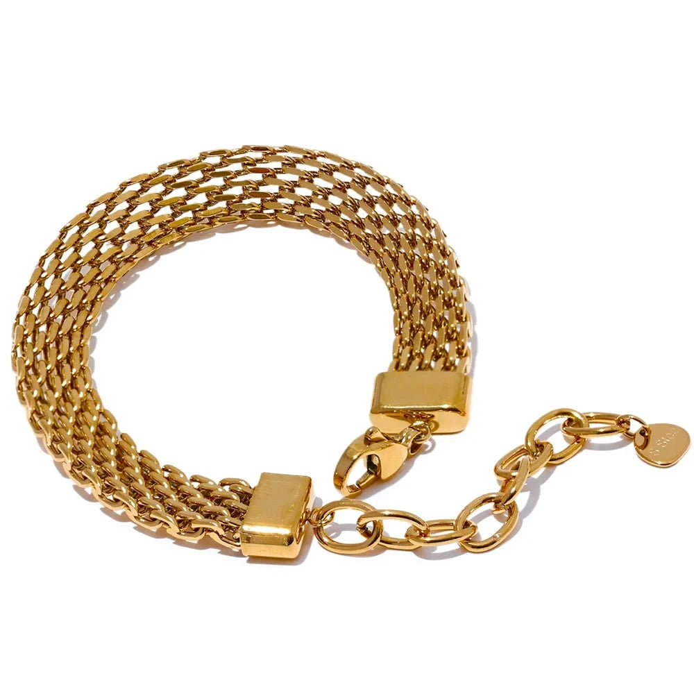 Jewelry gold jewelry flat lay with gold chain and gold bracelet