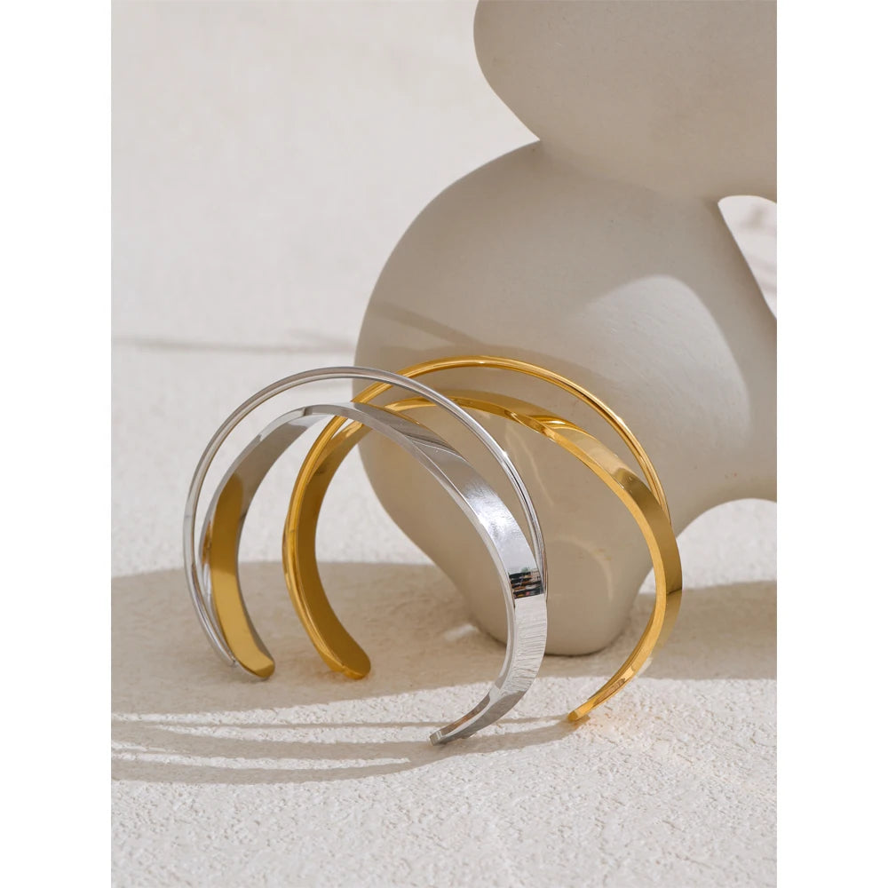 Minimal cuff bracelet shown in a warm gold plated tone
