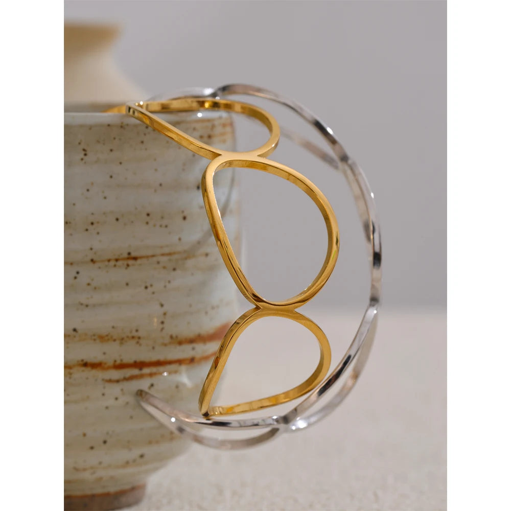 Bracelet for gold stacks shown as an adjustable gold cuff bangle
