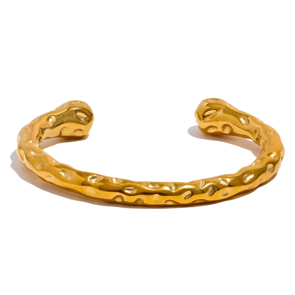 Gold plated gold bangle bracelet shown with soft bracelet with gold sheen