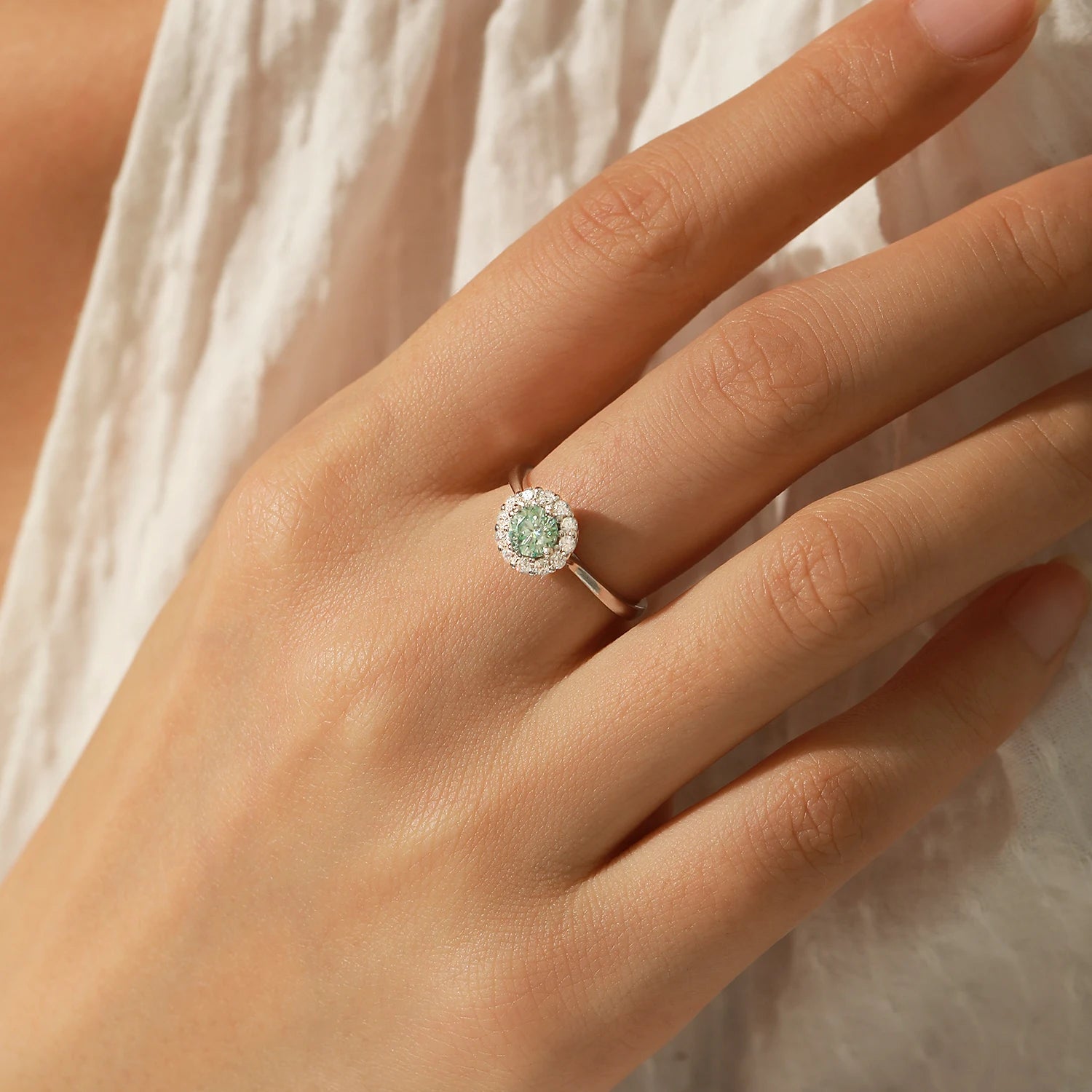 Sterling silver ring with halo green moissanite sparkle
