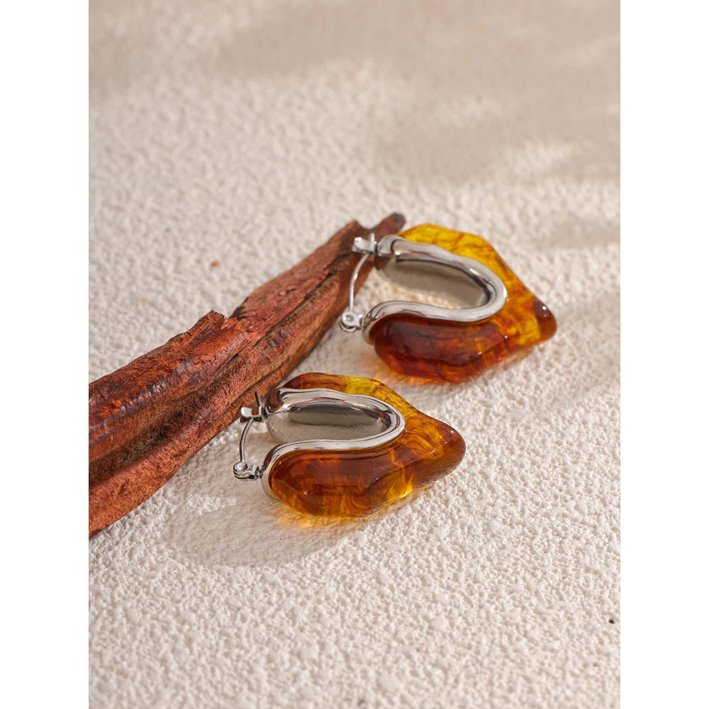 Gold and earrings design with amber resin detail