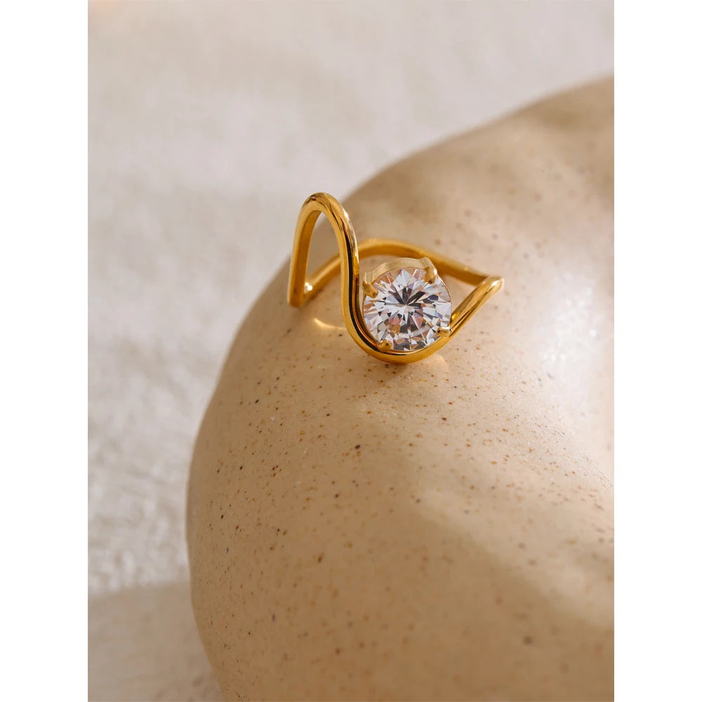 Close-up of ring showing cubic zirconia inlay on a gold plated band