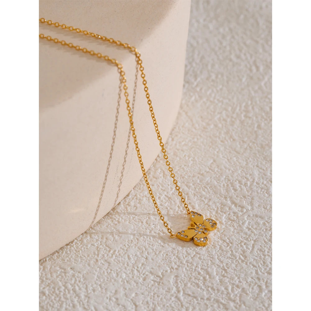 Close-up of butterfly pendant with gold-tone finish on chain
