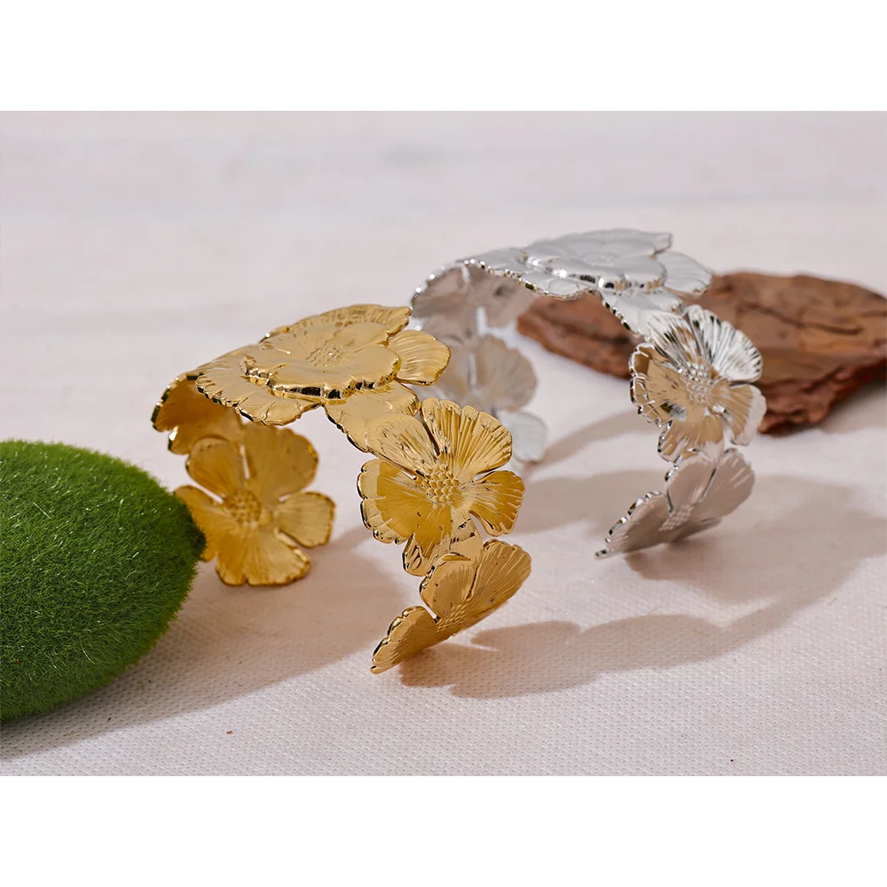 Elegant gold cuff bracelet with subtle flower bracelet detail