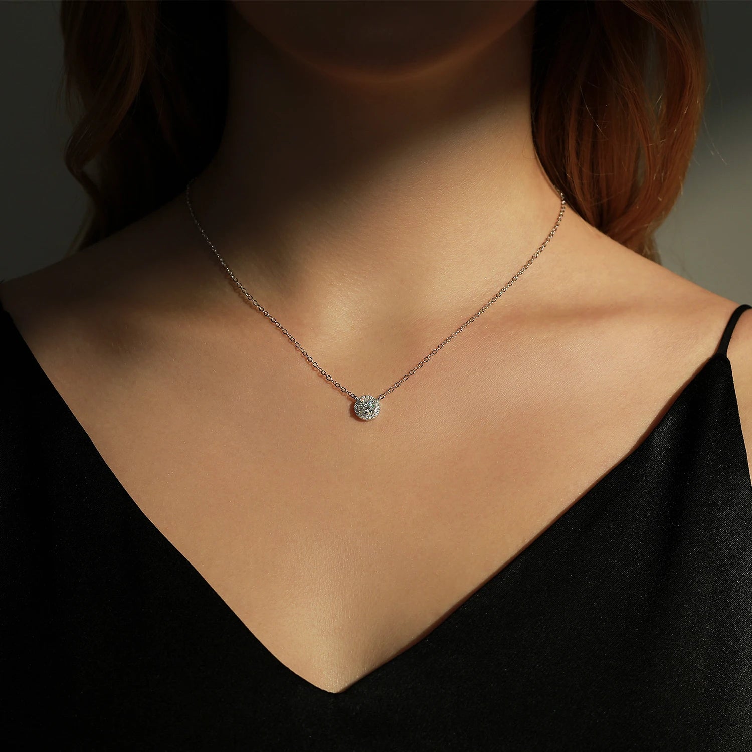 Round moissanite pendant necklace paired with matching earrings set and ring size guide card