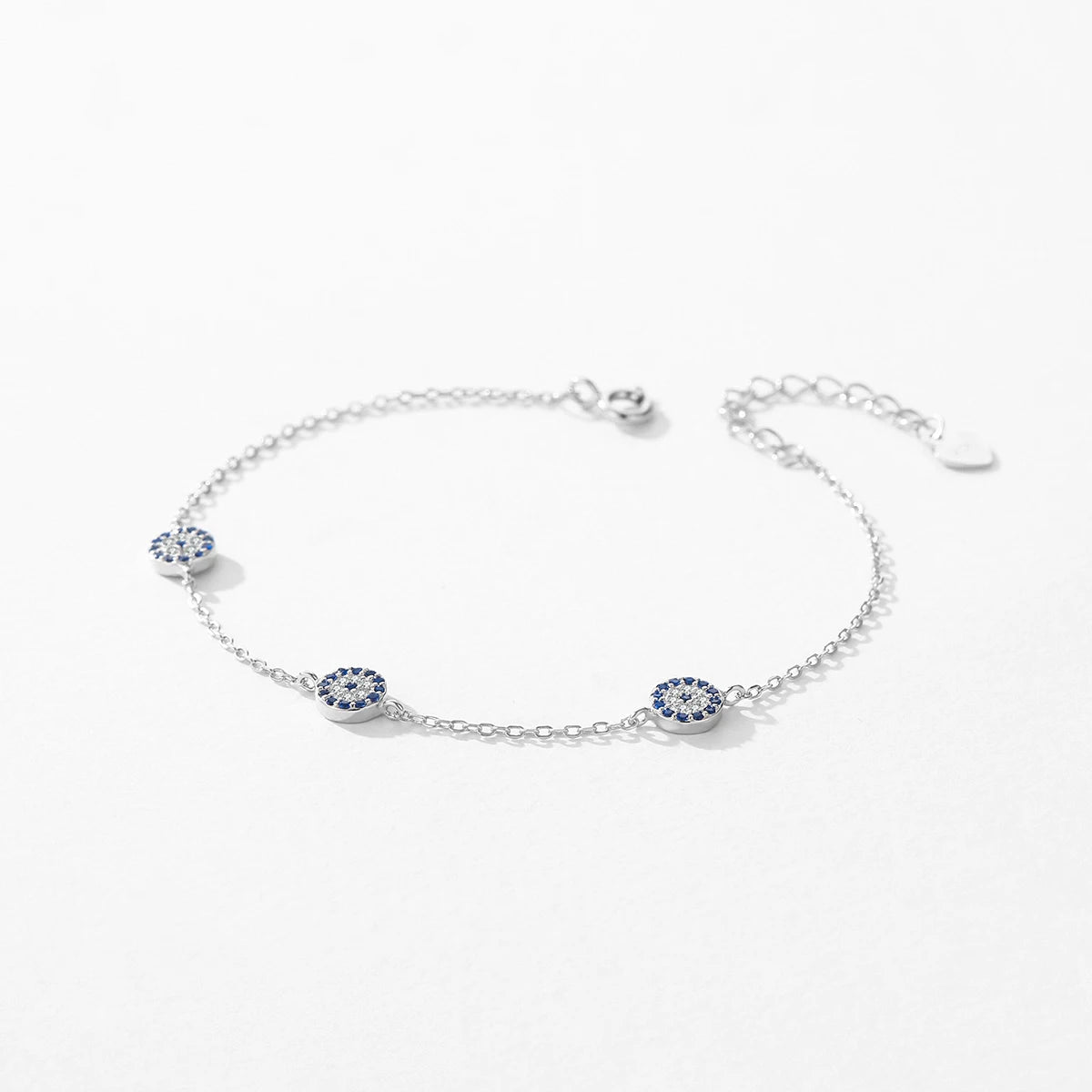 Adjustable silver chain bracelet with blue eye charm