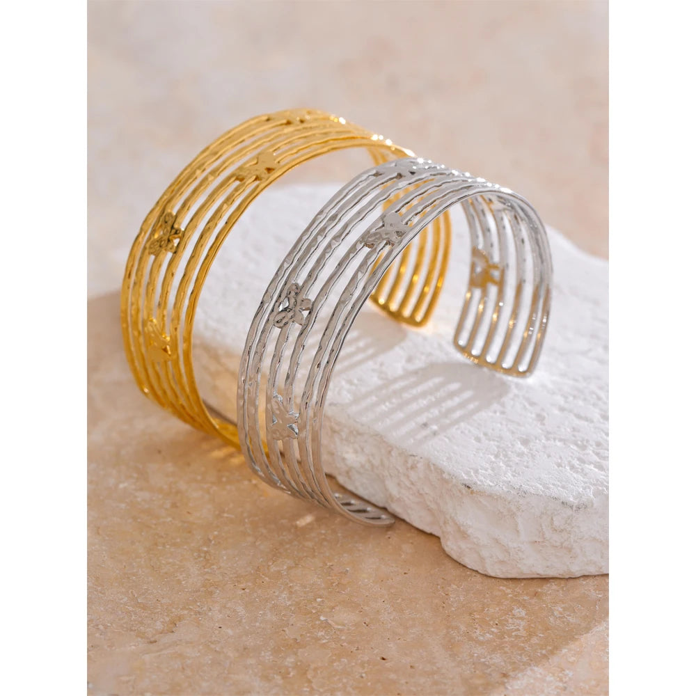 Butterfly bracelet motif on a cuff bracelet in gold for a gold plated finish