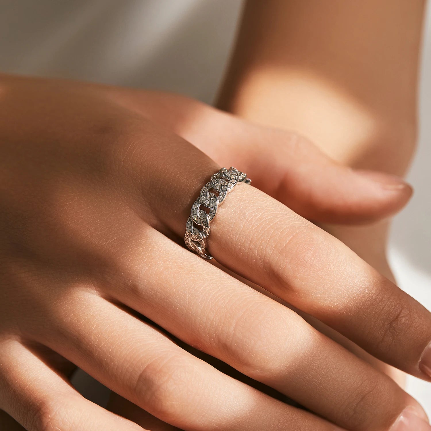 Sterling silver ring with cubic zirconia lock detail and silver color finish