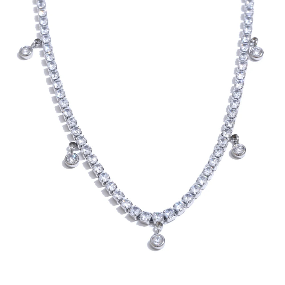 Matching bracelet adorned with cubic zirconia beside necklace