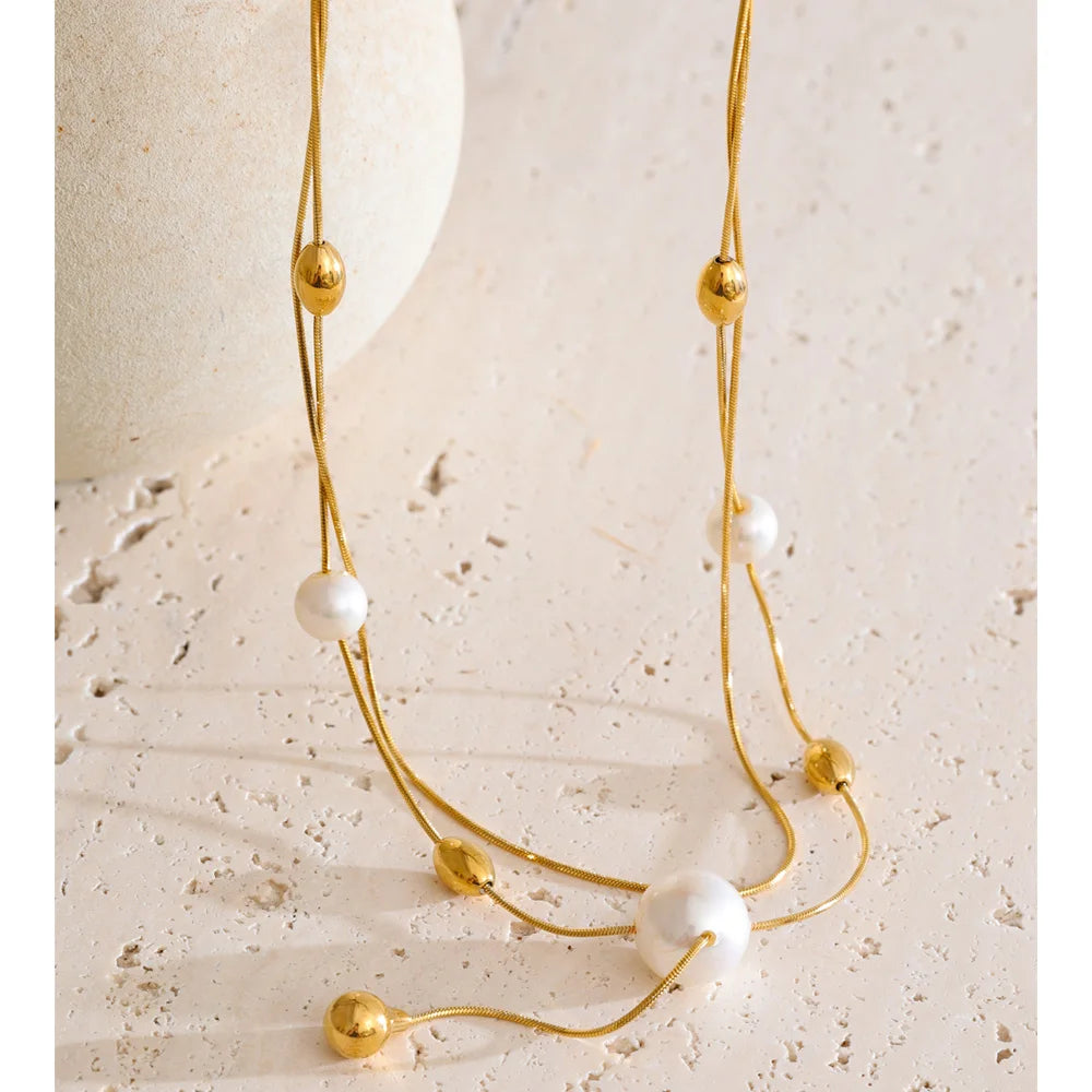 Necklace pearl necklace style featuring imitation pearls