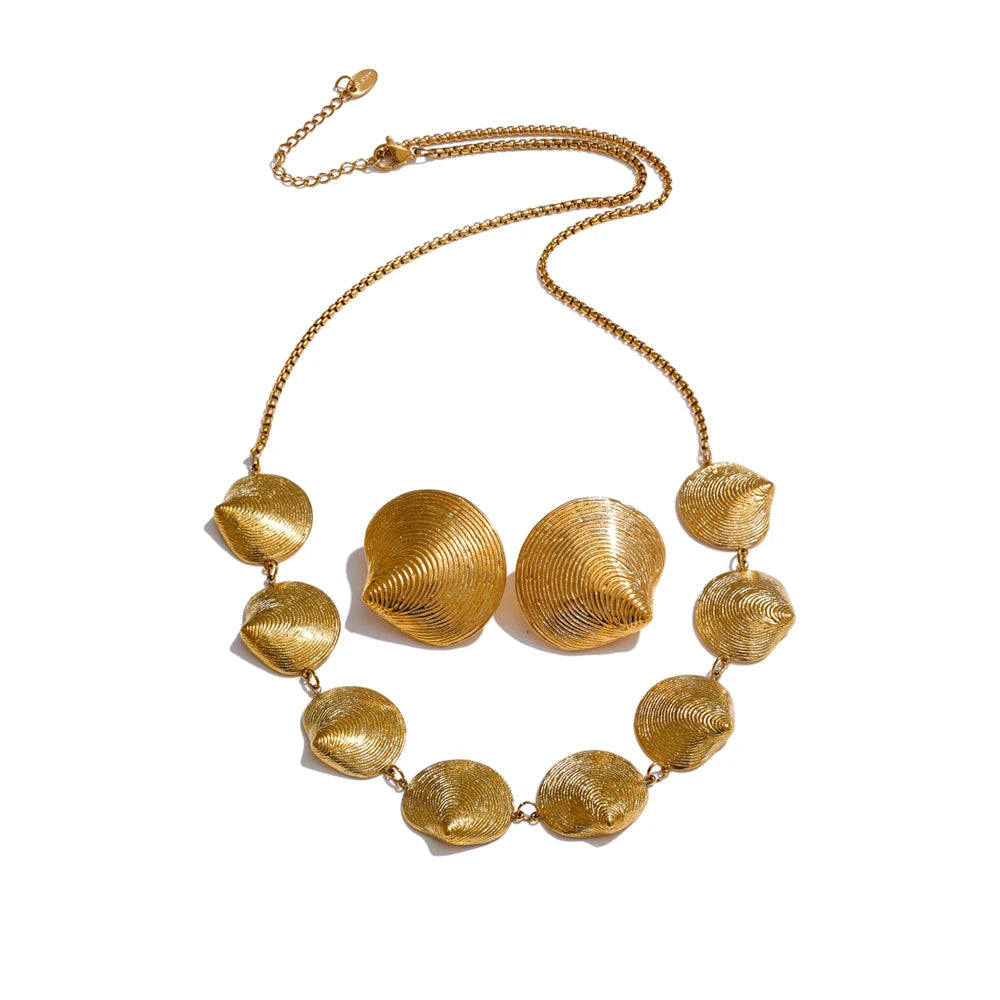 Gold jewelry necklace and earrings set with a refined glow