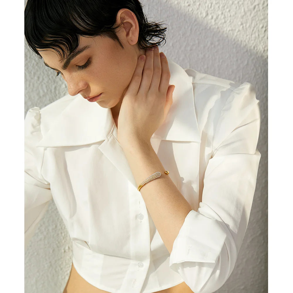 Bracelet with gold warmth paired with a subtle bracelet pearl