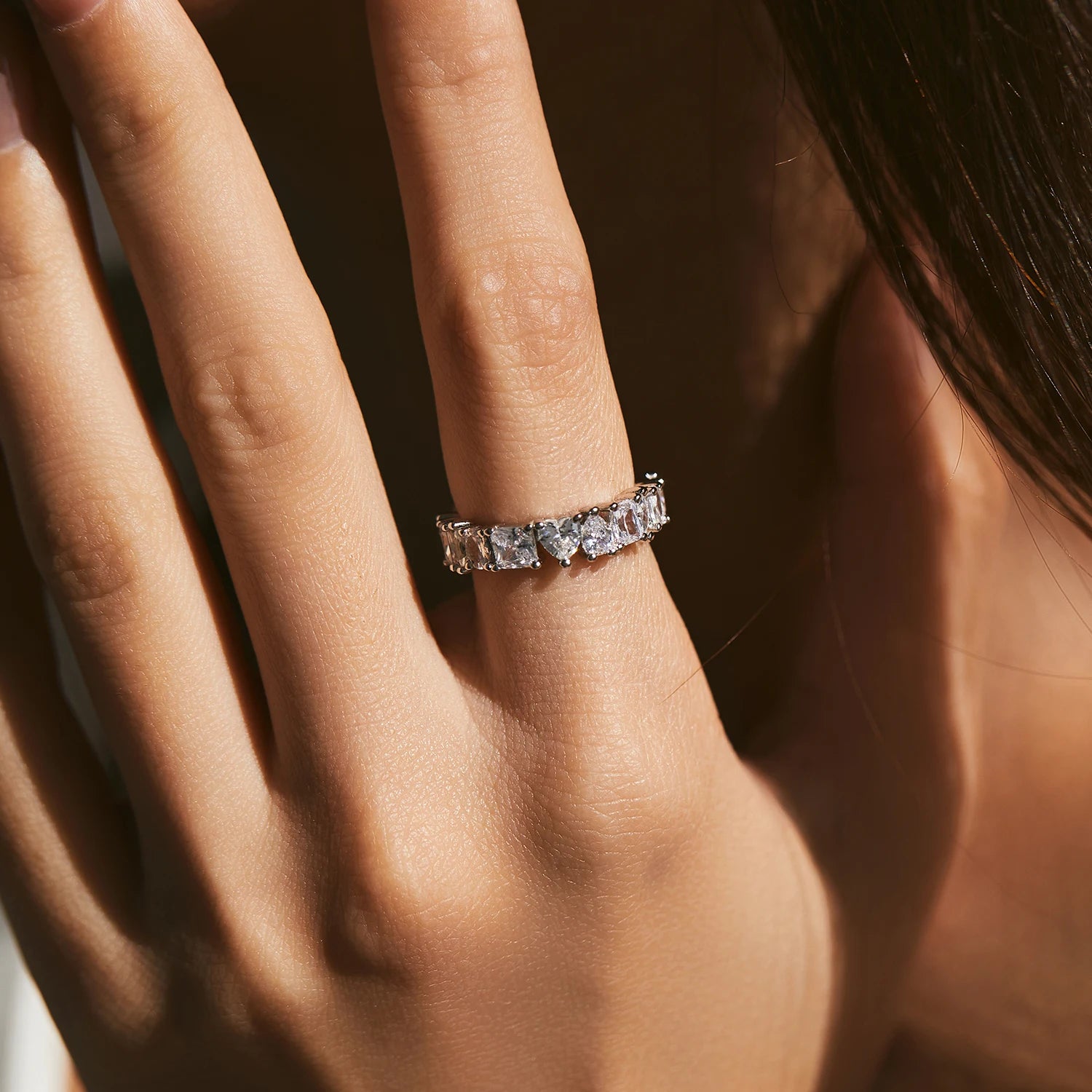 Wedding ring featuring zirconia stones in a geometric eternity band design