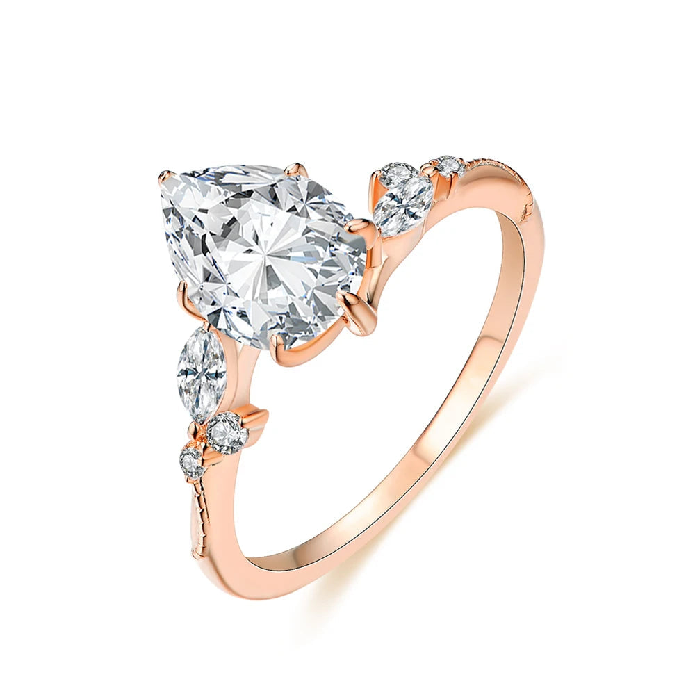 Gold ring ring stack paired with a moissanite ring centerpiece