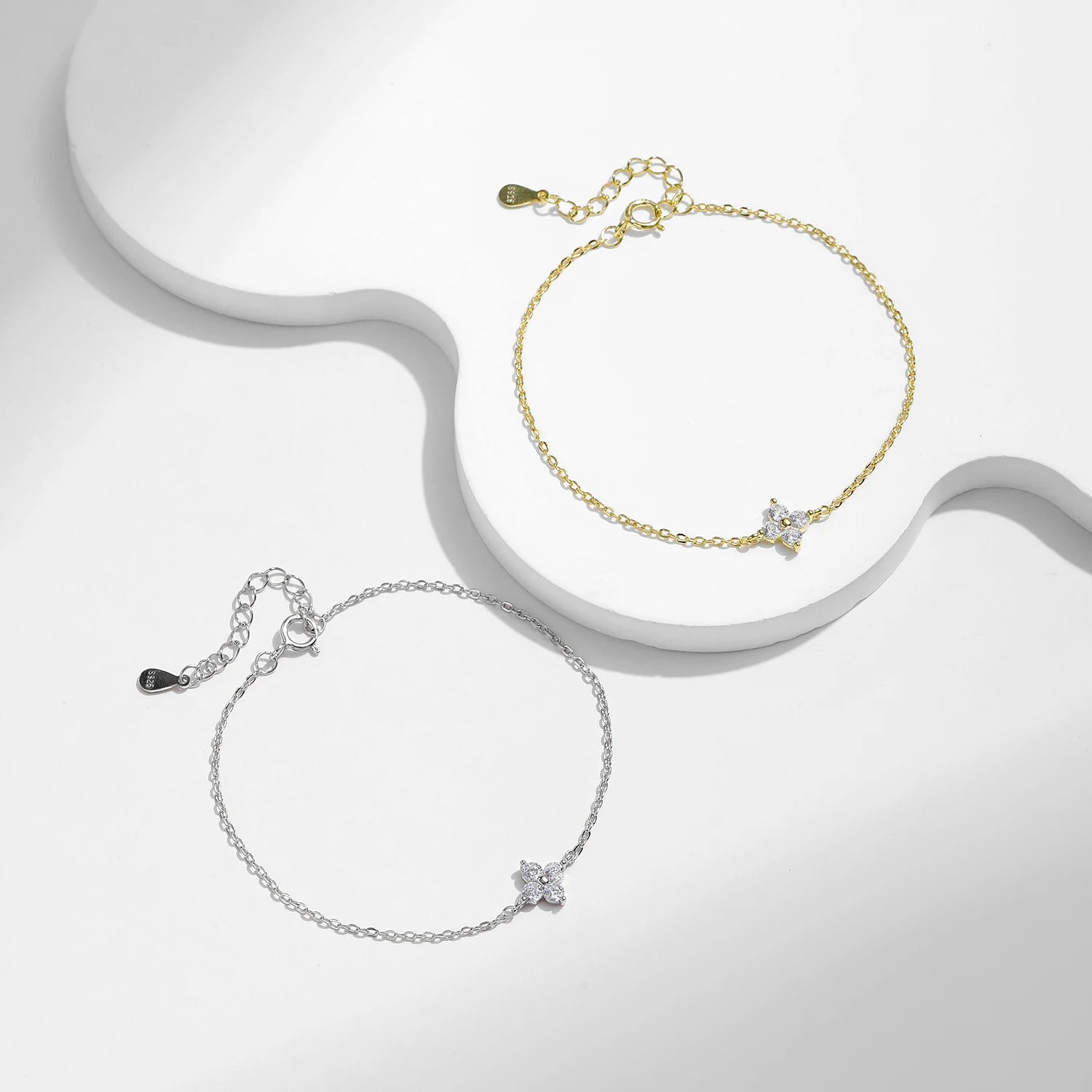 Close view of clover cz on a sleek bracelet charm in white gold