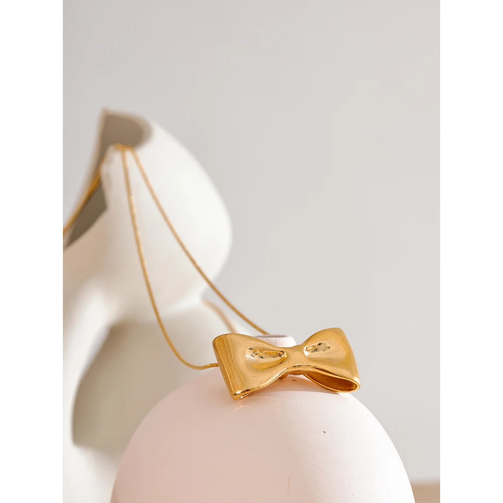 Adjustable gold necklace with bow knot charm statement style
