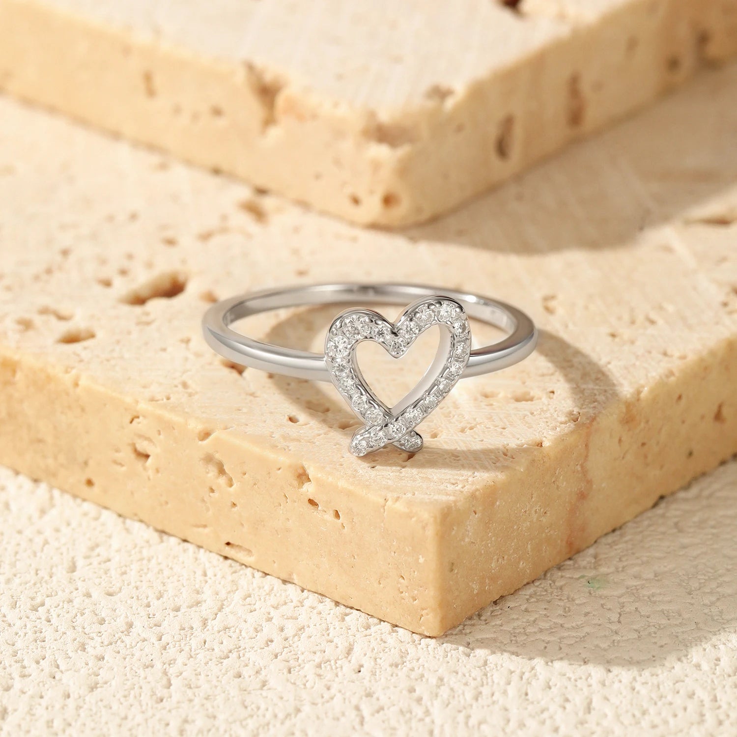 Delicate moissanite jewelry rings with heart motif and silver band