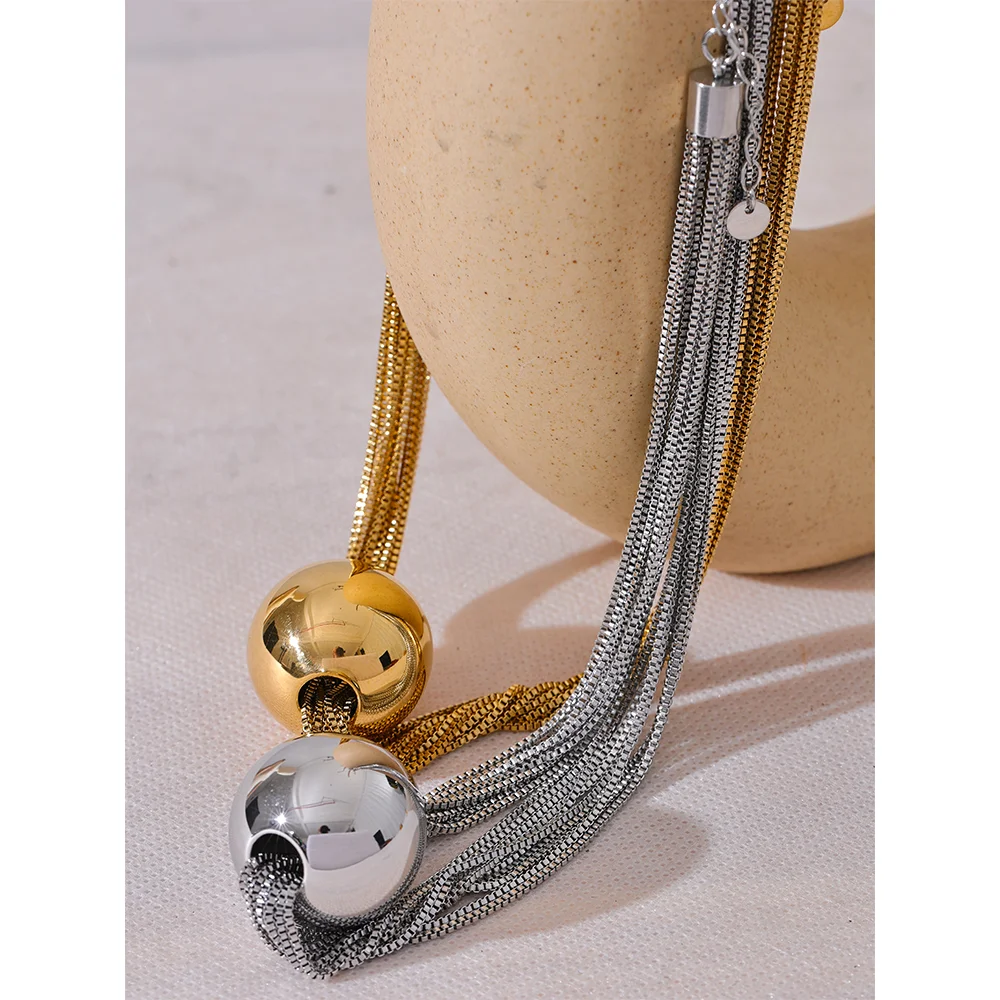 Necklace and necklace styling with layered chain and pendant ball