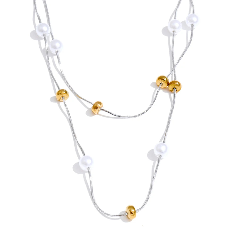 Necklace and necklace layering with classic pearl accents