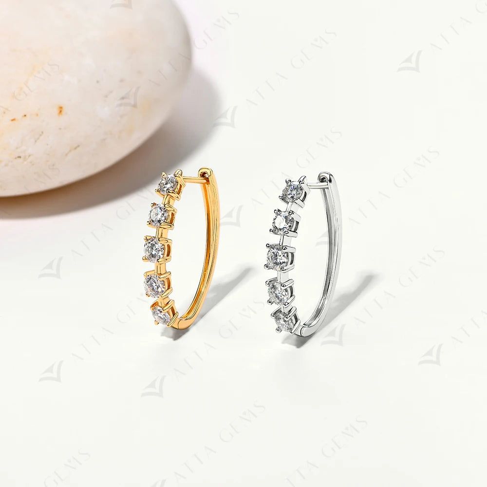 Close view of moissanite earrings with refined earrings gold finish