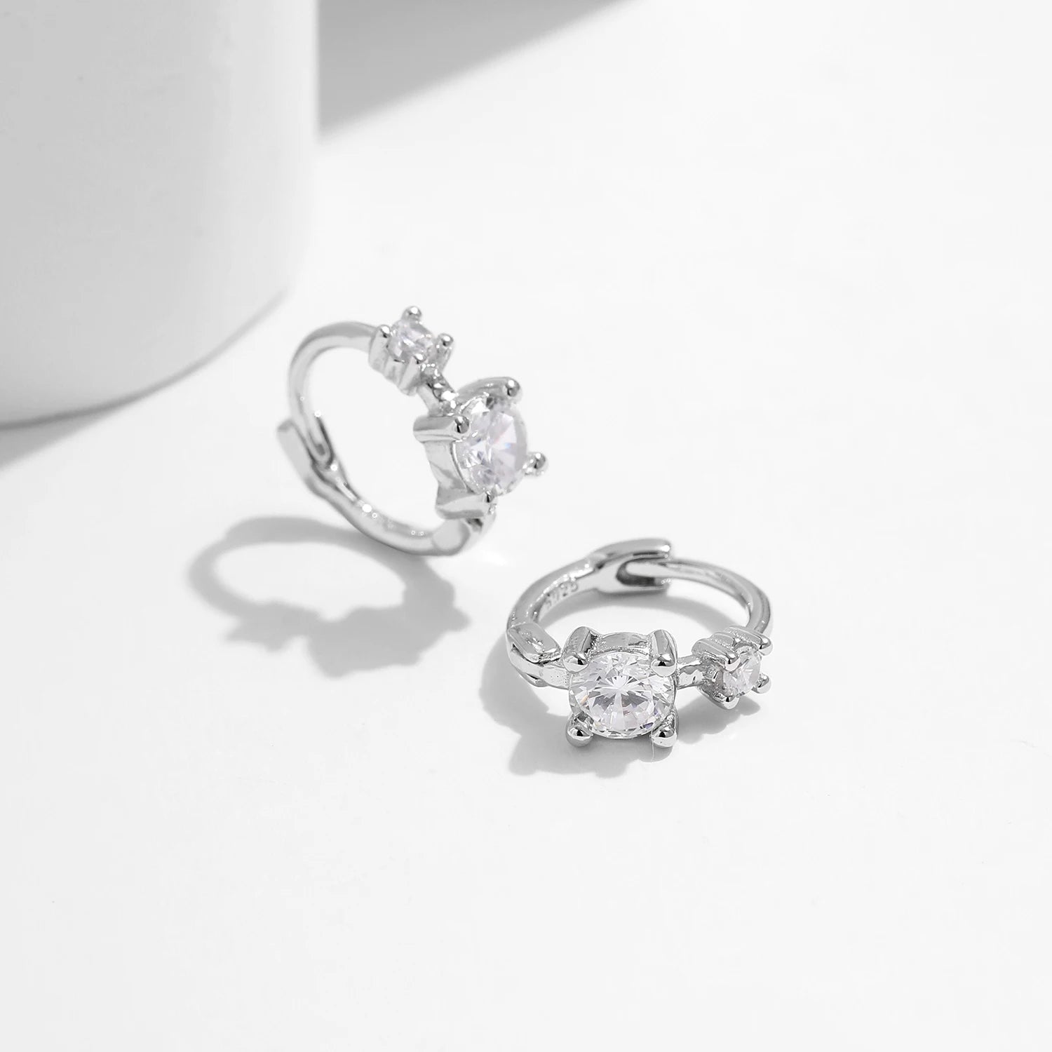 925 sterling silver earrings styled as tiny round hoop earrings