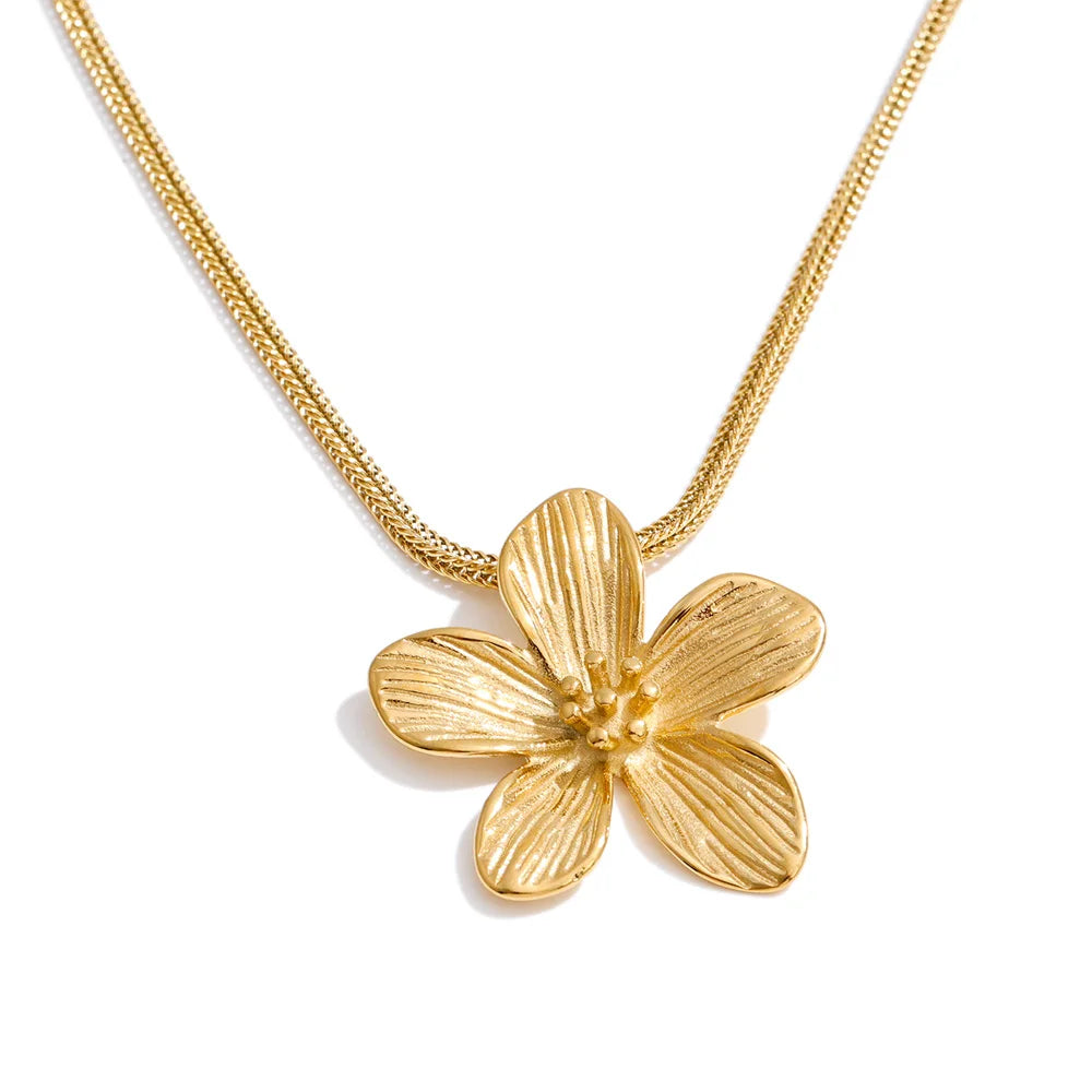 Minimalist flower necklace complementing outfit